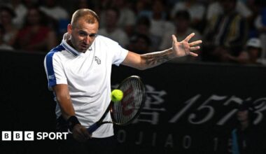 Daniel Evans hits a return