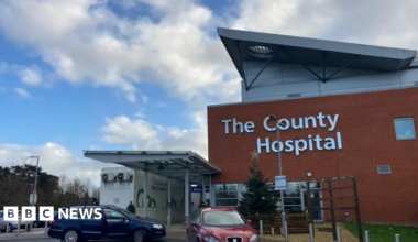 General view of the entrance and car park of Hereford County Hospital