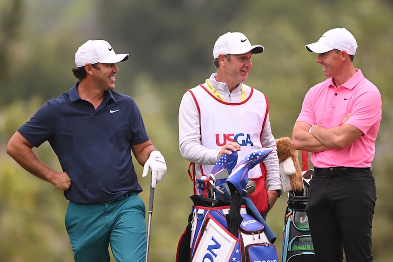 Rory McIlroy of Northern Ireland shares a laugh with Brooks Koepka of the United States and Ricky Elliott at the 2023 US Open. Photograph: Ross Kinnaird/Getty