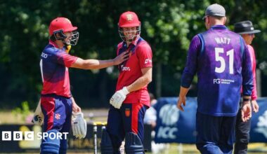 Nick Greenwood and Zak Tribe celebrate a boundary against Scotland