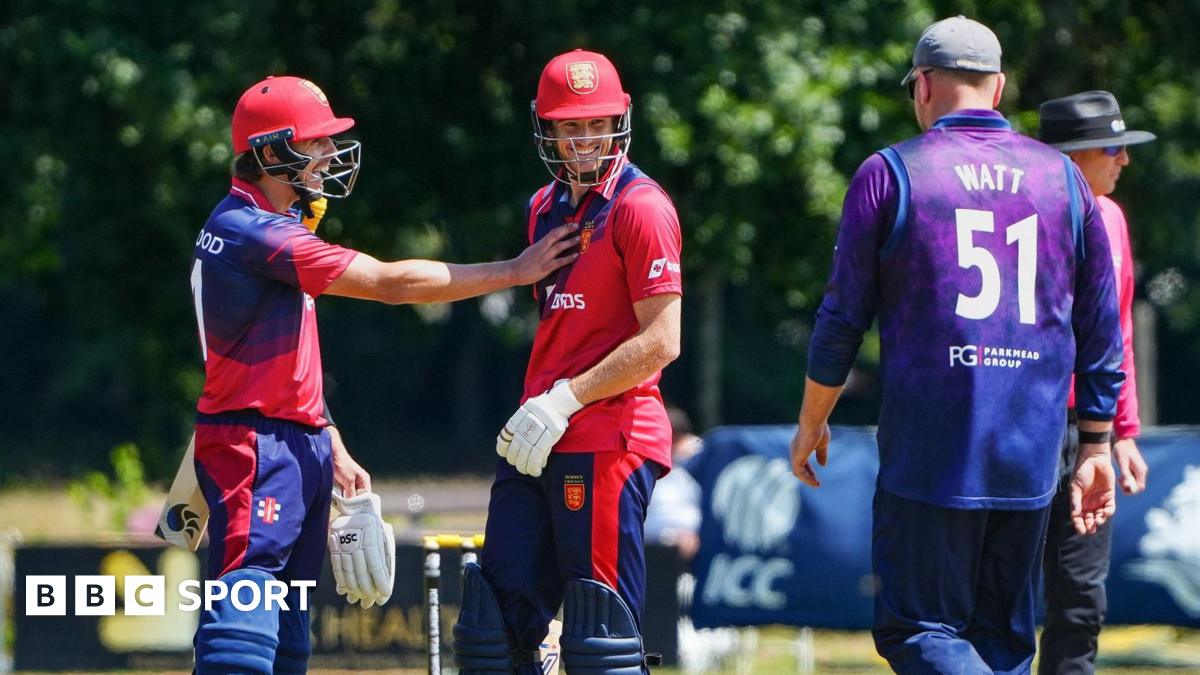 Nick Greenwood and Zak Tribe celebrate a boundary against Scotland
