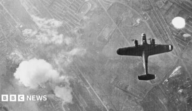 A black and white image of German bombers flying overhead in the UK.