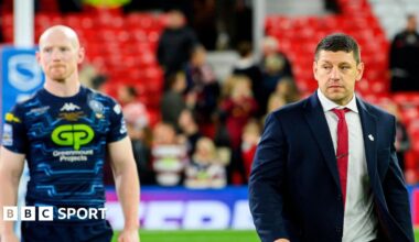 Wigan Warriors captain Liam Farrell and head coach Matt Peet walk from the field after their loss to Hull KR in the 2025 Super League Grand Final
