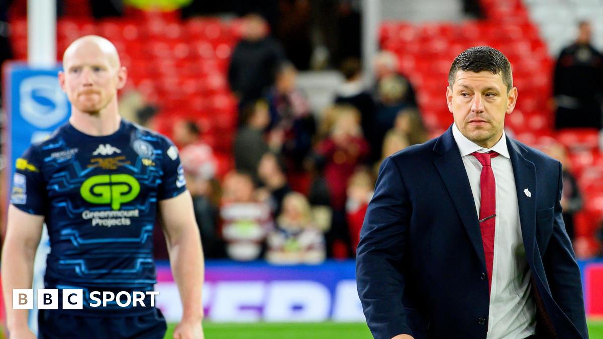 Wigan Warriors captain Liam Farrell and head coach Matt Peet walk from the field after their loss to Hull KR in the 2025 Super League Grand Final