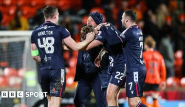 Dundee celebrate their derby victory at Tannadice
