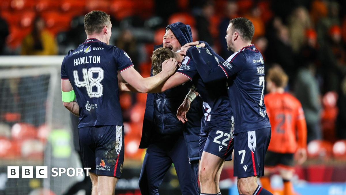 Dundee celebrate their derby victory at Tannadice