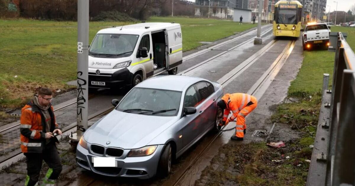 Manchester LIVE: City centre chaos after BMW gets stuck on tracks | UK | News