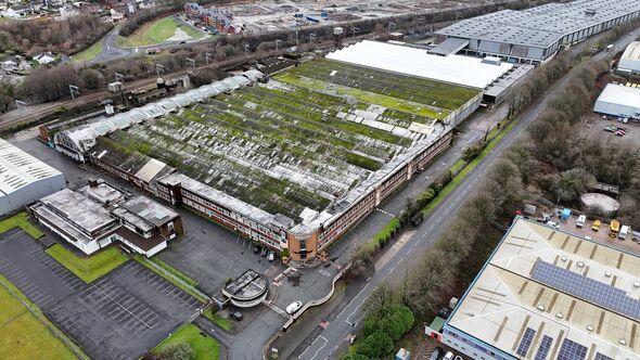 An aerial view of a large empty industrial site