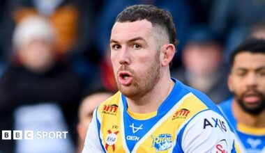 Cameron Smith about to pass the ball during his testimonial game for Leeds Rhinos