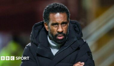 Luke Littler celebrates winning the 2026 PDC World Championship as tickertape falls