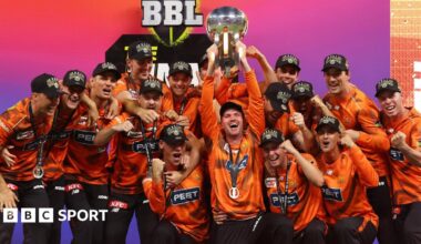 Perth Scorchers players celebrate as they lift the 2025-26 Big Bash League trophy following victory over Sydney Sixers