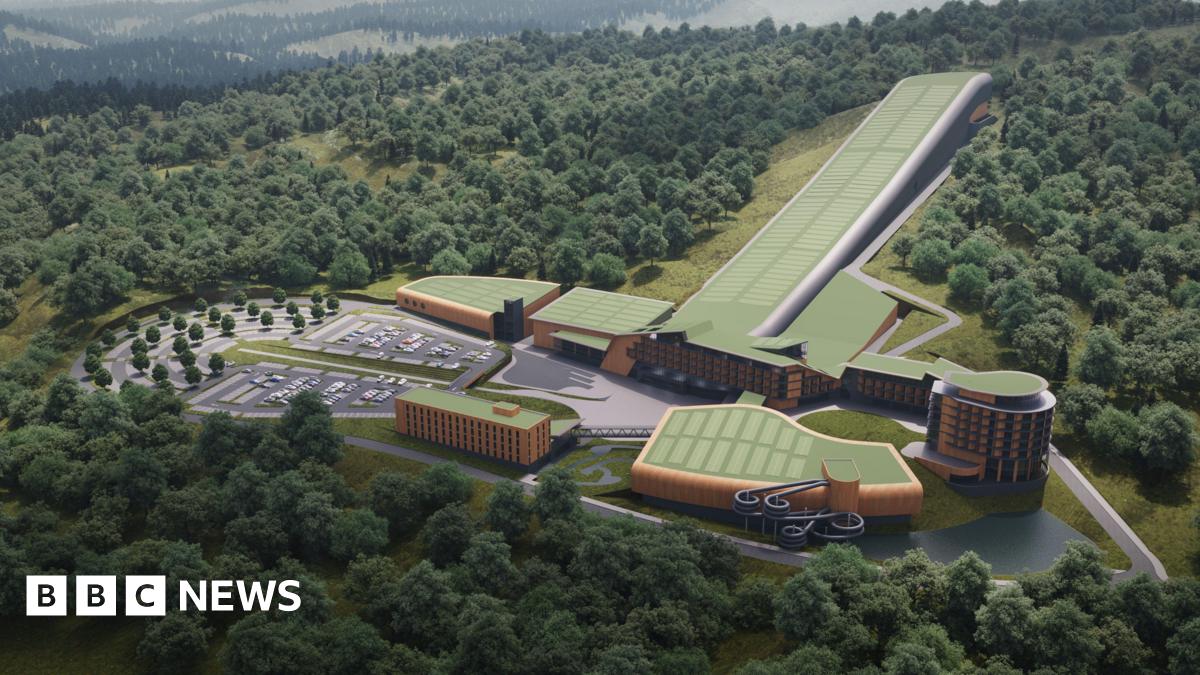 A computer generated picture showing a number of large buildings set into the side of a hill with trees.  One of the buildings is very long and narrow in shape and sloped down the hillside.