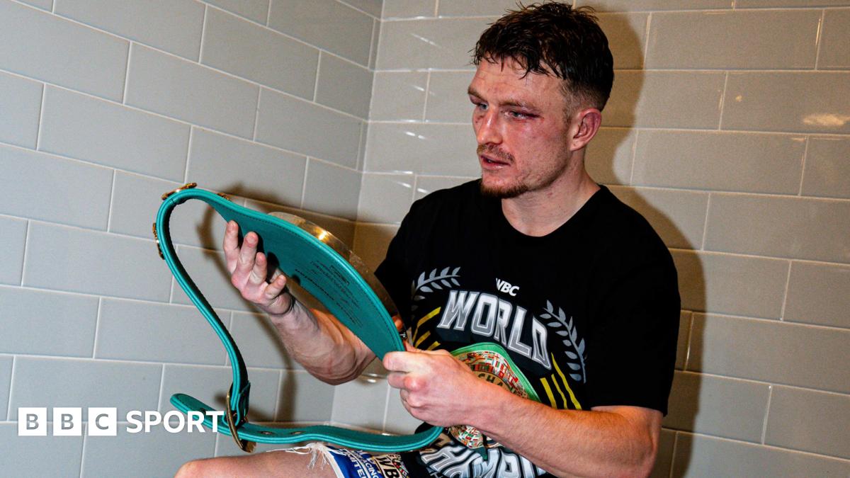 Dalton Smith in the changing rooms looking at his WBC world title
