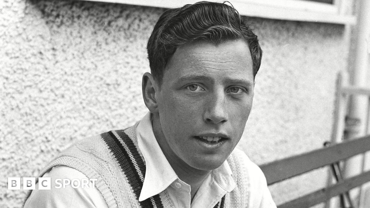 A black and white picture of Norman Gifford sitting outside the pavillion at New Road