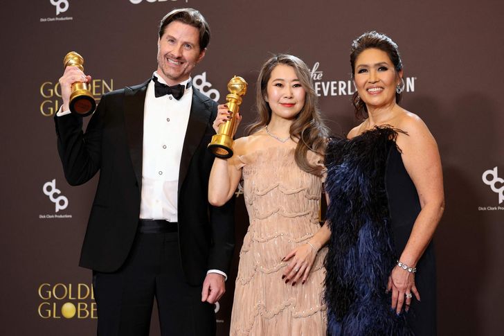 From left, Chris Appelhans, Maggie Kang and Michelle Wong, winners of the award for Best Motion Picture — Animated for 'KPop Demon Hunters,' pose in the press room during the 83rd Annual Golden Globes at The Beverly Hilton in Beverly Hills, Calif., Sunday (local time). AFP-Yonhap
