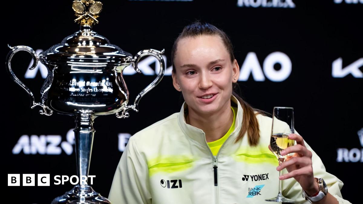 Elena Rybakina drinks champagne at her news conference after winning the Australian Open