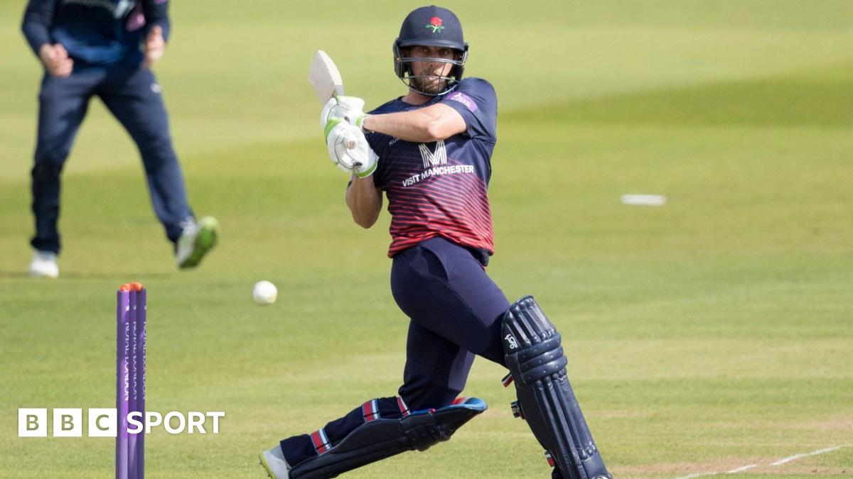 Jake Lehmann plays shot through the covers wearing Lancashire white ball clothing