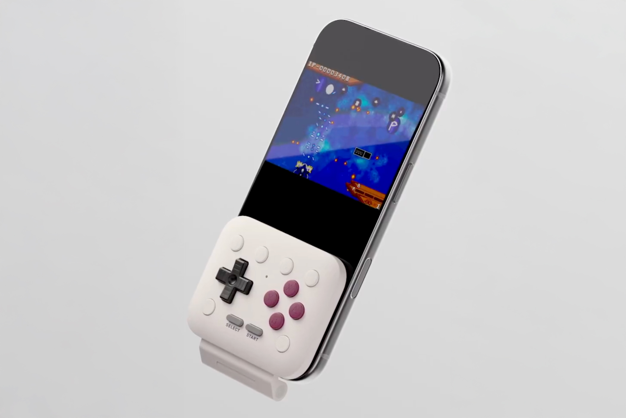 The 8BitDo FlipPad controller attached to a smartphone.