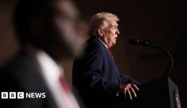 Donald Trump, seen in profile, stands at a podium to deliver a speech in Iowa on Tuesday.