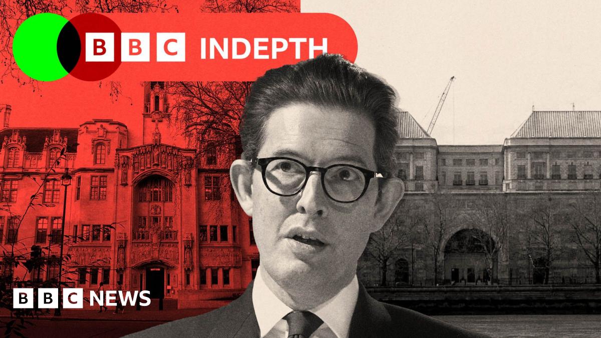 Eugene Thompson holds up a poster featuring a photo of his brother