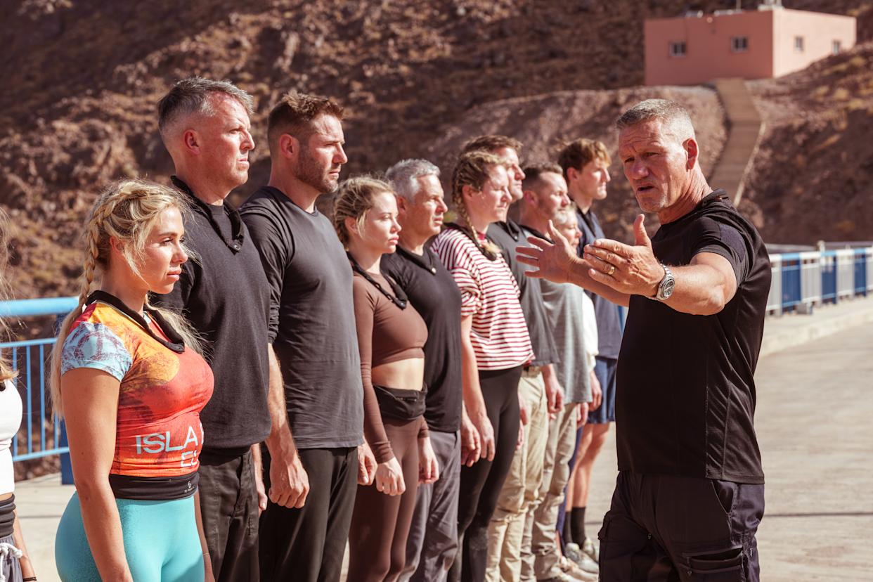 Pictured: Celebrity recruits lined up on dam wall, with DS Billy, before Plane Dunk