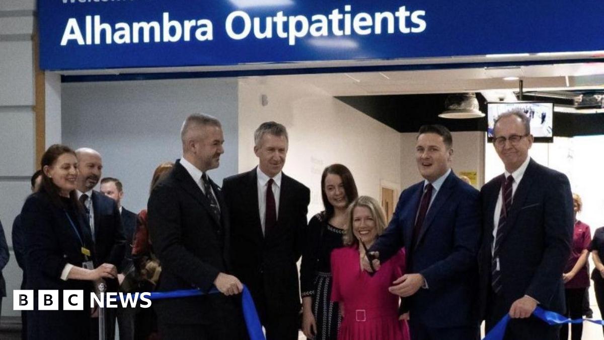 An image of a ribbon cutting service at the entrance to the outpatients service.  Health Secretary Wes Streeting is pictured with scissors in his hand alongside Barnsley council leader Sir Steve Houghton, local MPs Marie Tidball, Dan Jarvis and Stephanie Peacock and South Yorkshire Mayor Oliver Coppard.