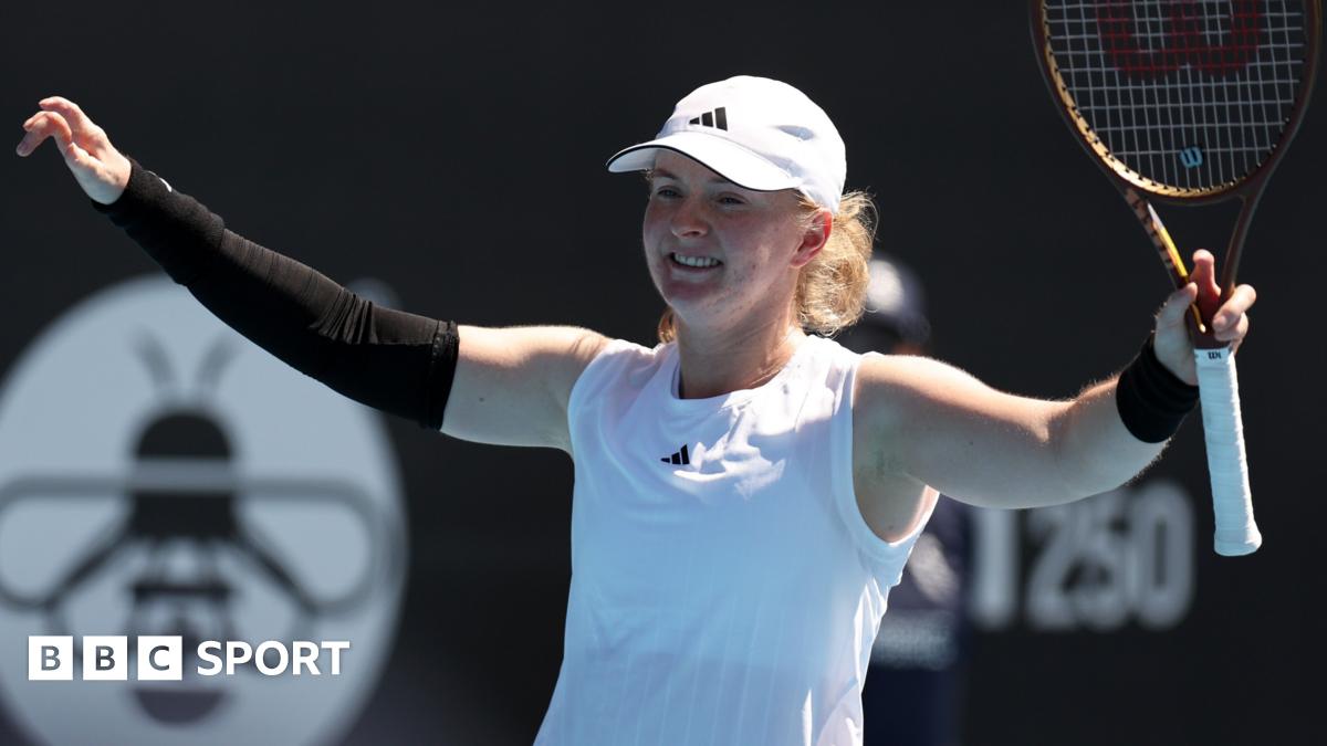 Francesca Jones raises her arms in celebration after victory at the Auckland Classic
