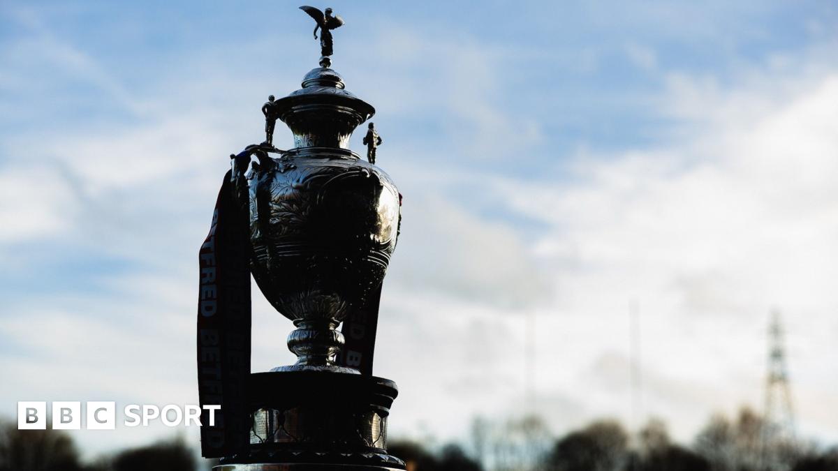 Joel Farrell celebrates with a muscle-flexing pose after scoring for Sheffield against Whitehaven, as opposing players look on ruefully