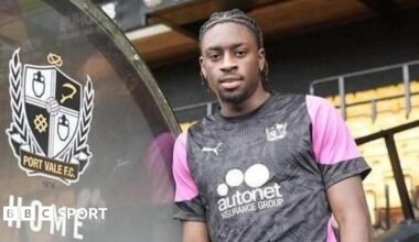 Ethon Archer leaning against the dugout in a Port Vale training top