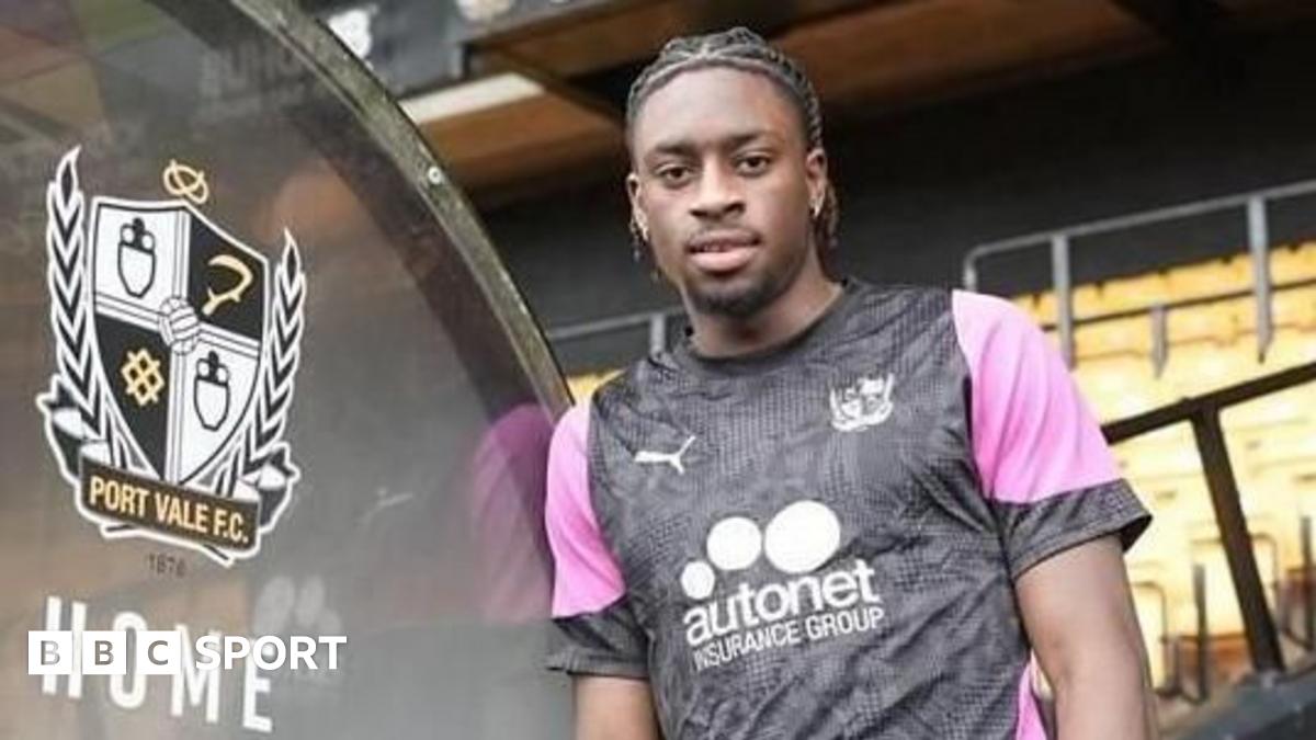 Ethon Archer leaning against the dugout in a Port Vale training top