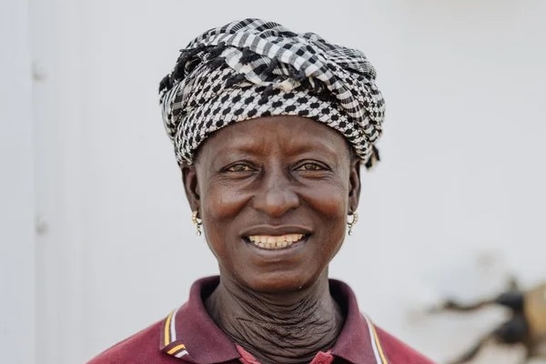 Sasa smiles at the camera, she no longer has a large goitre on her neck