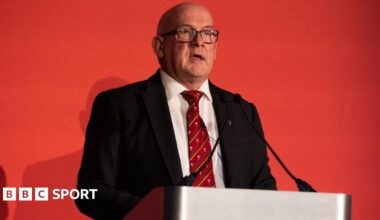 Luke Littler celebrates winning the 2026 PDC World Championship as tickertape falls