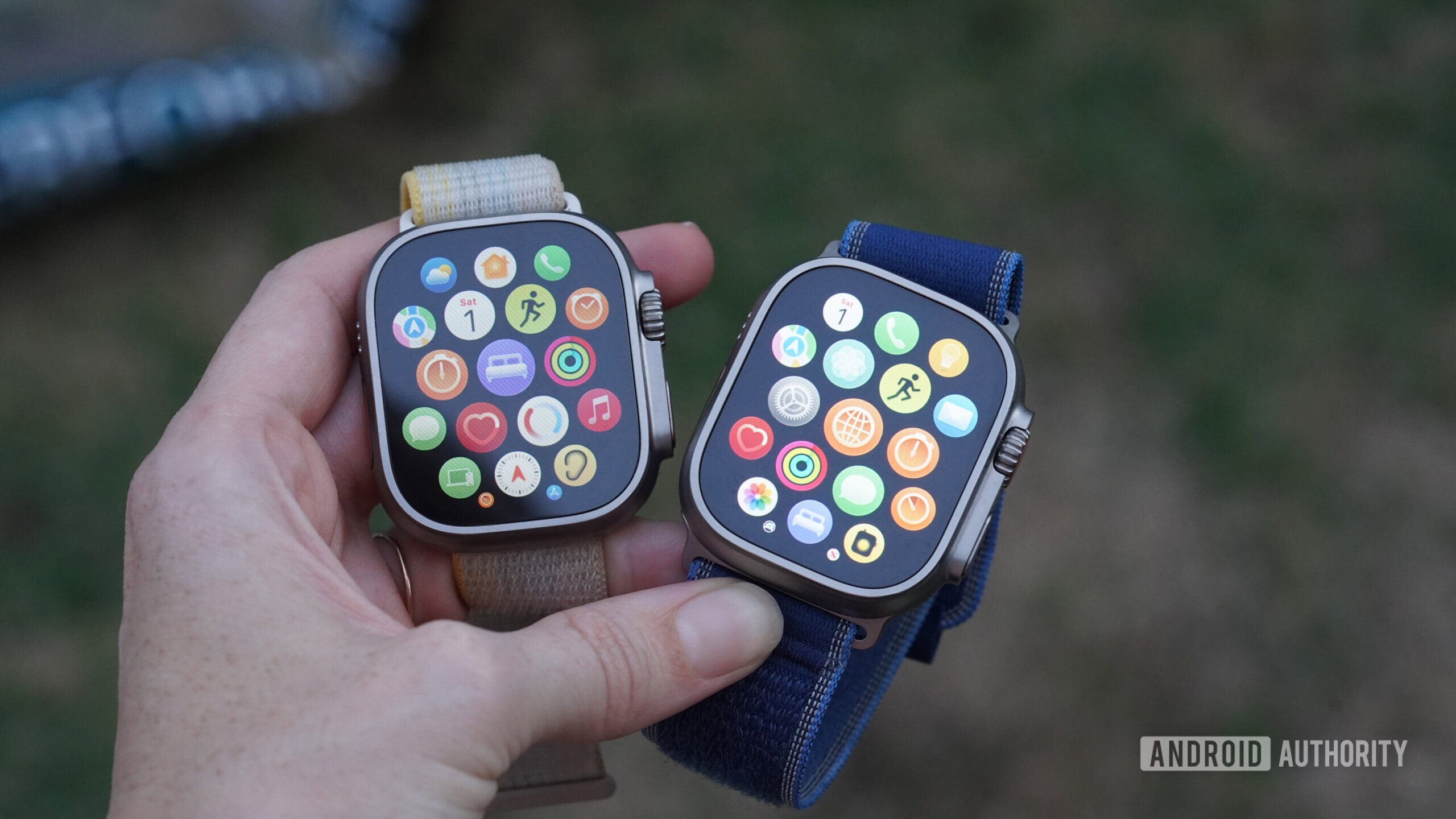A use holds and Apple Watch Ultra 2 and Ultra 3 side by side.