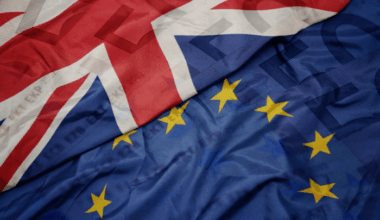 The European Union flag next to the national flag of Great Britain.