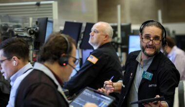 Chip stocks jump on AI optimism; Dow ends at record high