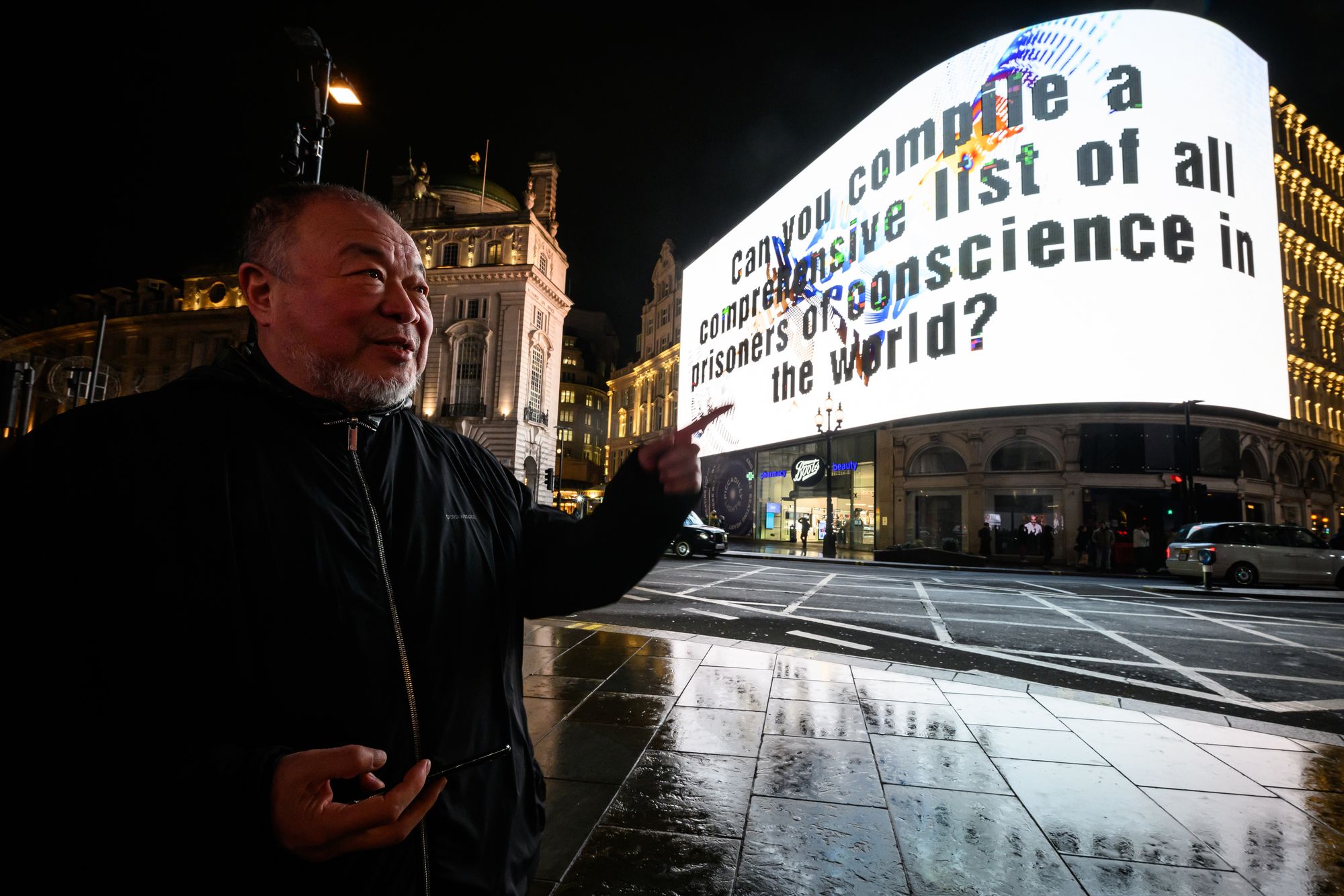 Ai Weiwei at his installation in Piccadilly Circus in London in 2024