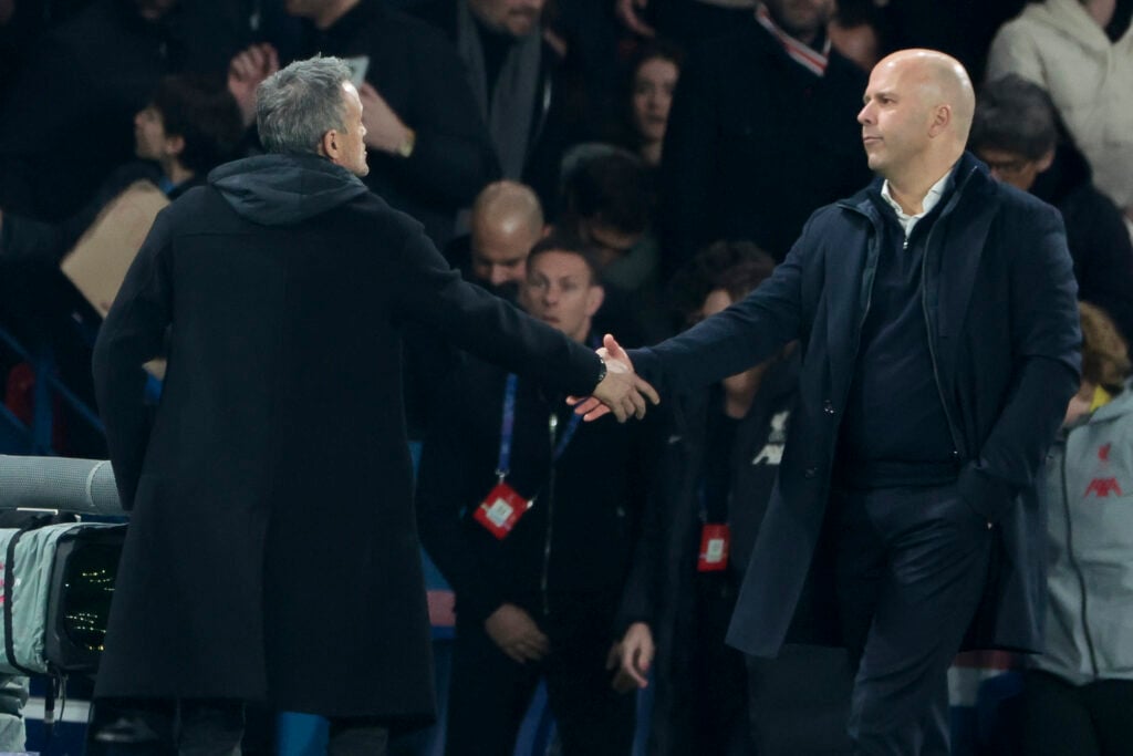 Luis Enrique and Arne Slot shake hands after the UEFA Champions League last-16 match between PSG and Liverpool at the Parc des Princes.