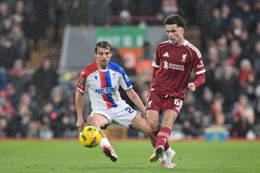 Borna Sosa of Crystal Palace and Kieran Morrison of Liverpool F.C. battle for a ball during the Carabao Cup Fourth Round match between Liverpool and Crystal Palace at Anfield.