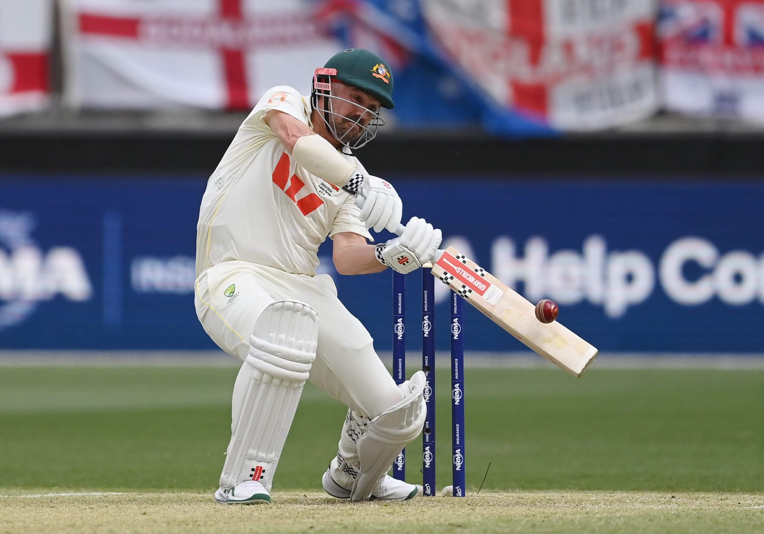 Travis Head launches a ball over extra cover