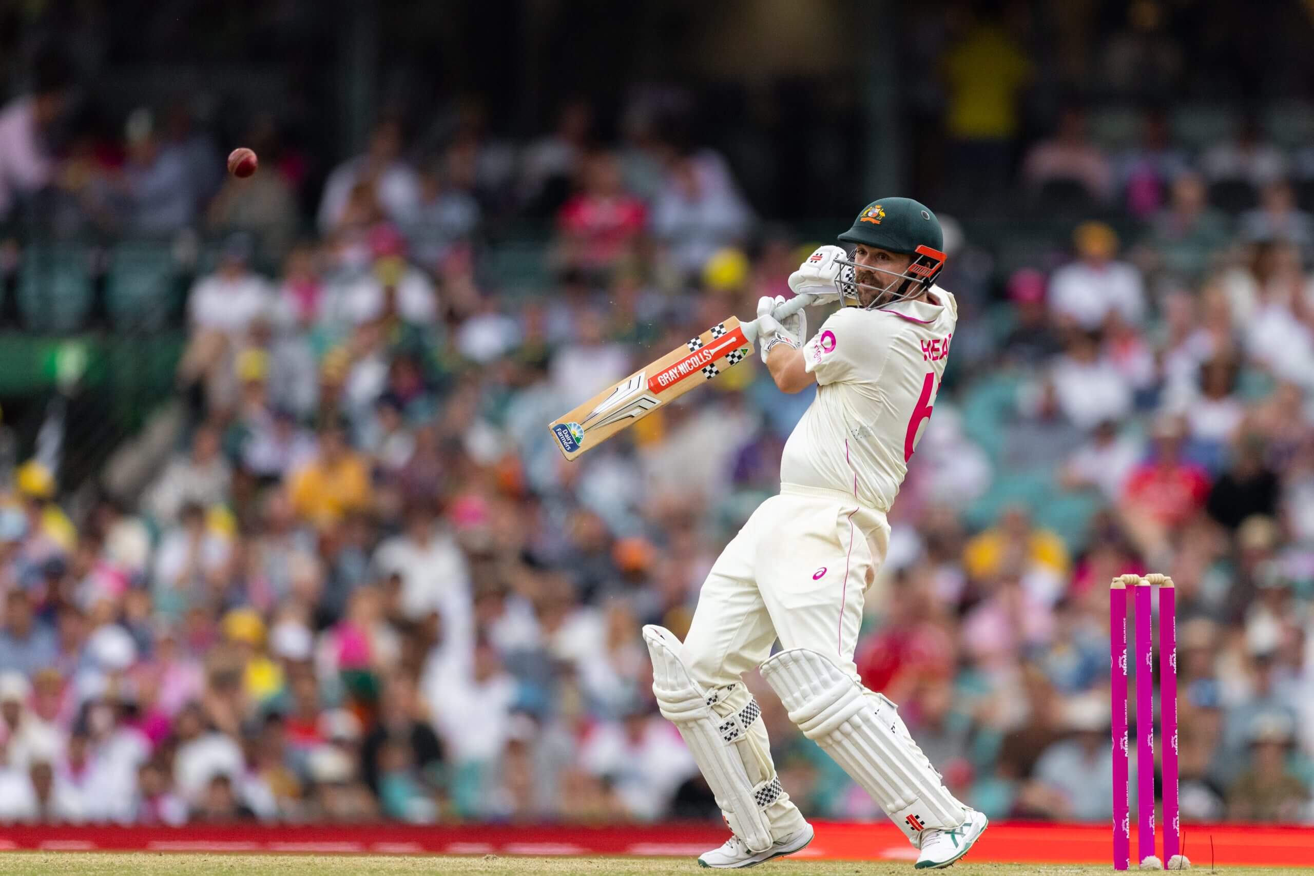 Travis Head cuts on his way to a century at the SCG