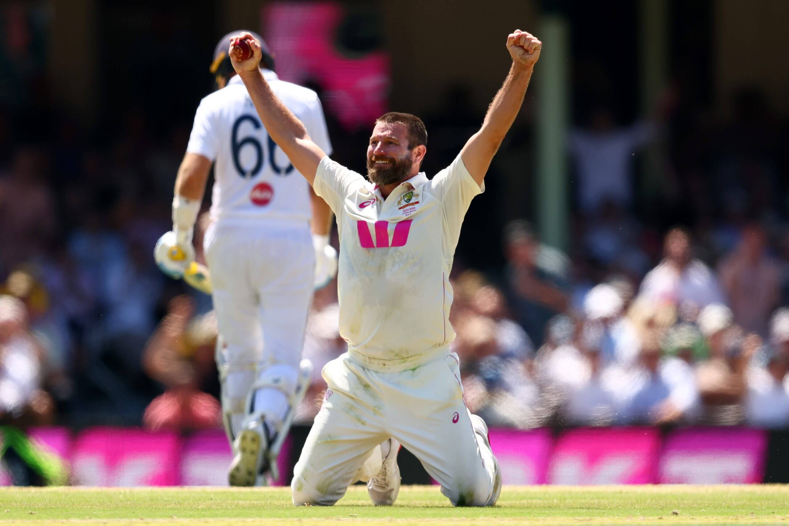 Michael Neser celebrates with both arms aloft