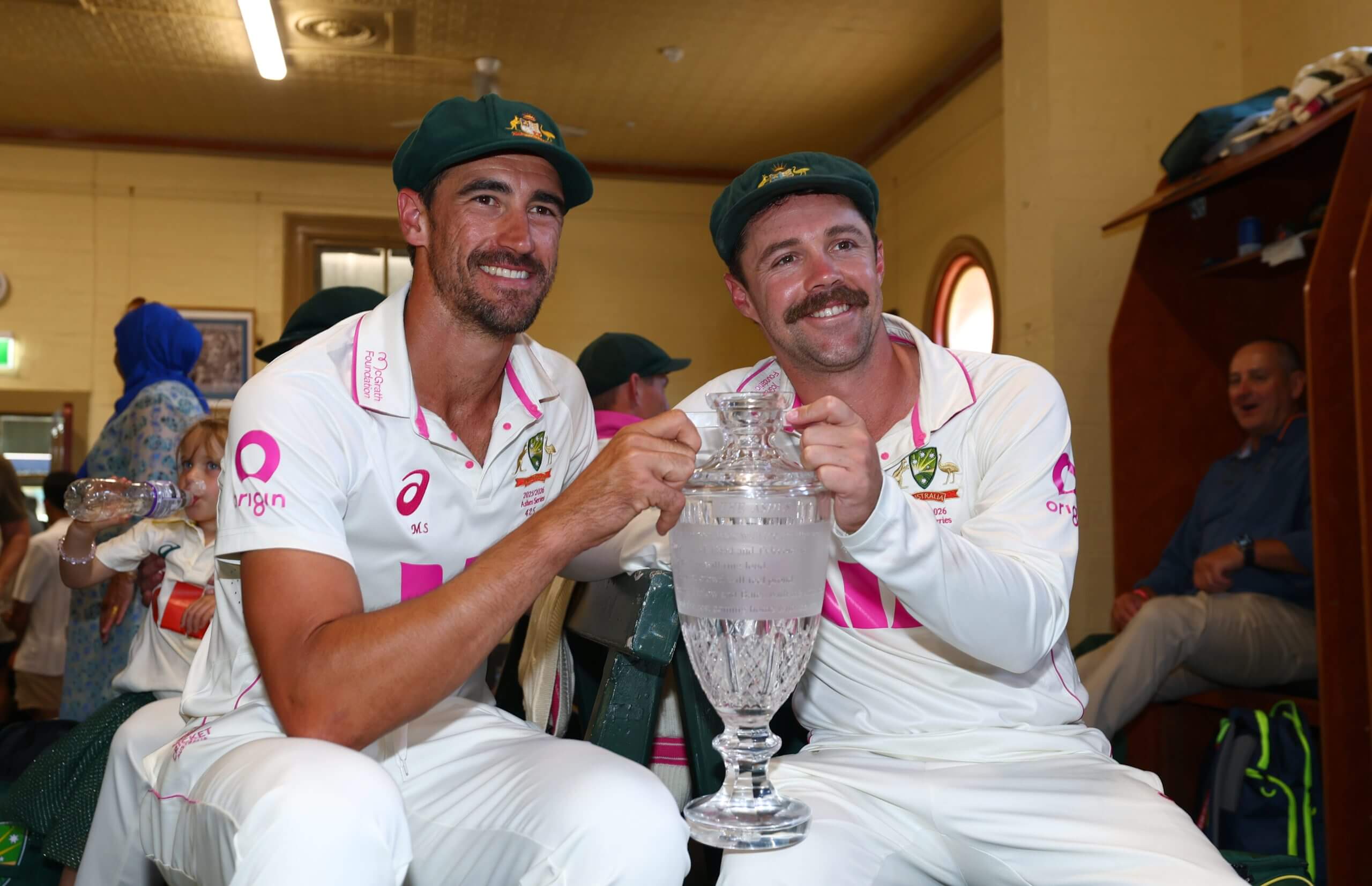 Mitchell Starc and Travis Head hold the Ashes trophy at the SCG