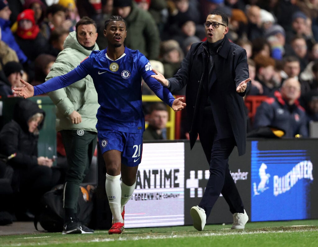 Liam Rosenior, Manager of Chelsea, and Jorrel Hato of Chelsea react during the Emirates FA Cup Third Round match between Charlton Athletic and Chelsea