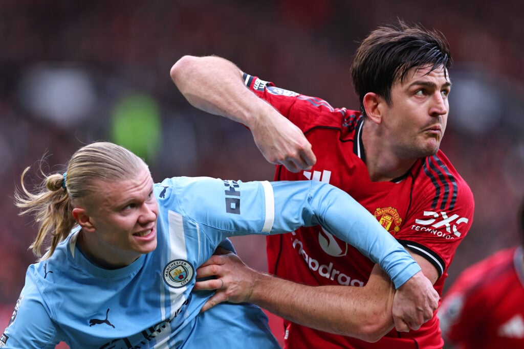 Erling Haaland of Manchester City tussels with Harry Maguire of Manchester United during the Premier League match between Manchester United and Manchester City at Old Trafford on January 17, 2026