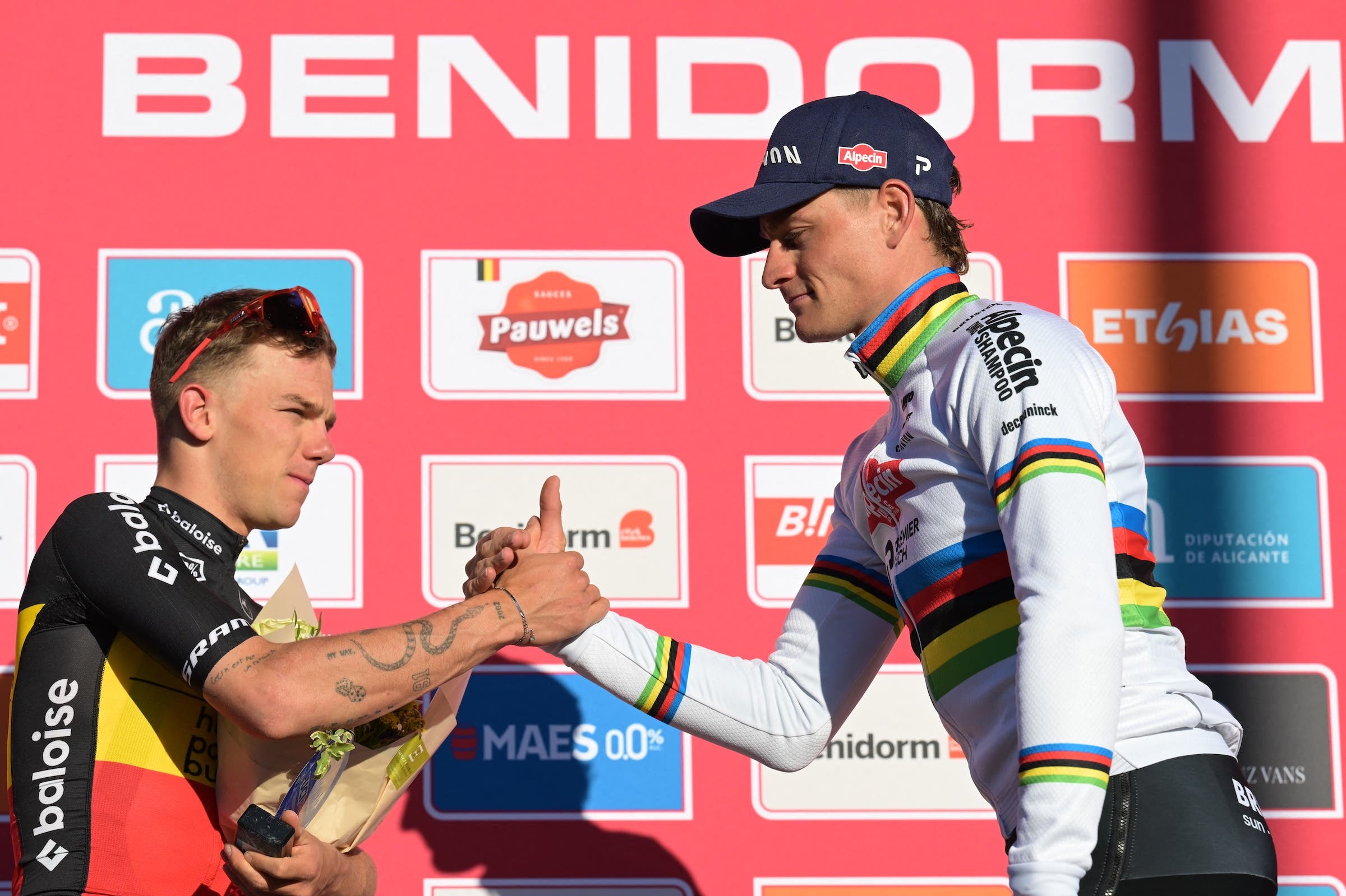Thibau Nys and Mathieu Van Der Poel pictured on the podium after the Men's Elite race at the cyclocross cycling event in Benidorm, Spain, Sunday 18 January 2026, stage 10/12 in the UCI World Cup competition. (Photo: David Pintens / Belga Mag via AFP)