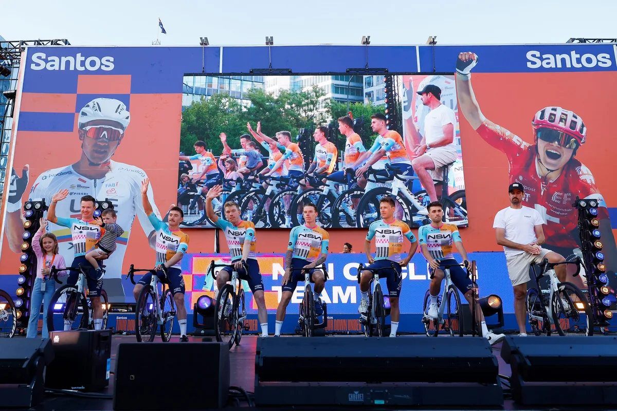ADELAIDE, AUSTRALIA - JANUARY 16: A general view of Simon Clarke of Australia, Brady Gilmore of Australia, Nick Schultz of Australia, Jake Stewart of Great Britain, Corbin Strong of New Zealand, Ethan Vernon of Great Britain and NSN Cycling Team during the 26th Santos Tour Down Under 2026, Team Presentation on January 16, 2026 in Adelaide, Australia. (Photo by Con Chronis/Getty Images)