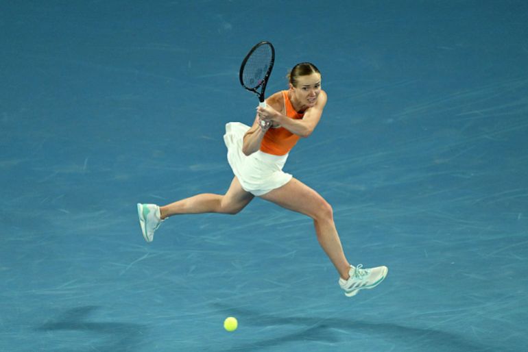 Elina Svitolina of Ukraine plays a backhand against Coco Gauff of the United States during the Women's Singles Quarterfinal match on day 10 of the 2026 Australian Open 