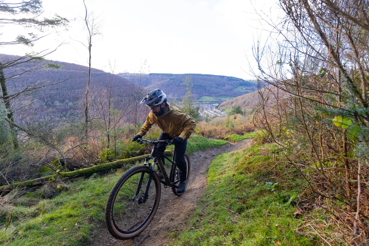 Giant Talon 0 hardtail mountain bike being ridden up a trail centre climb.