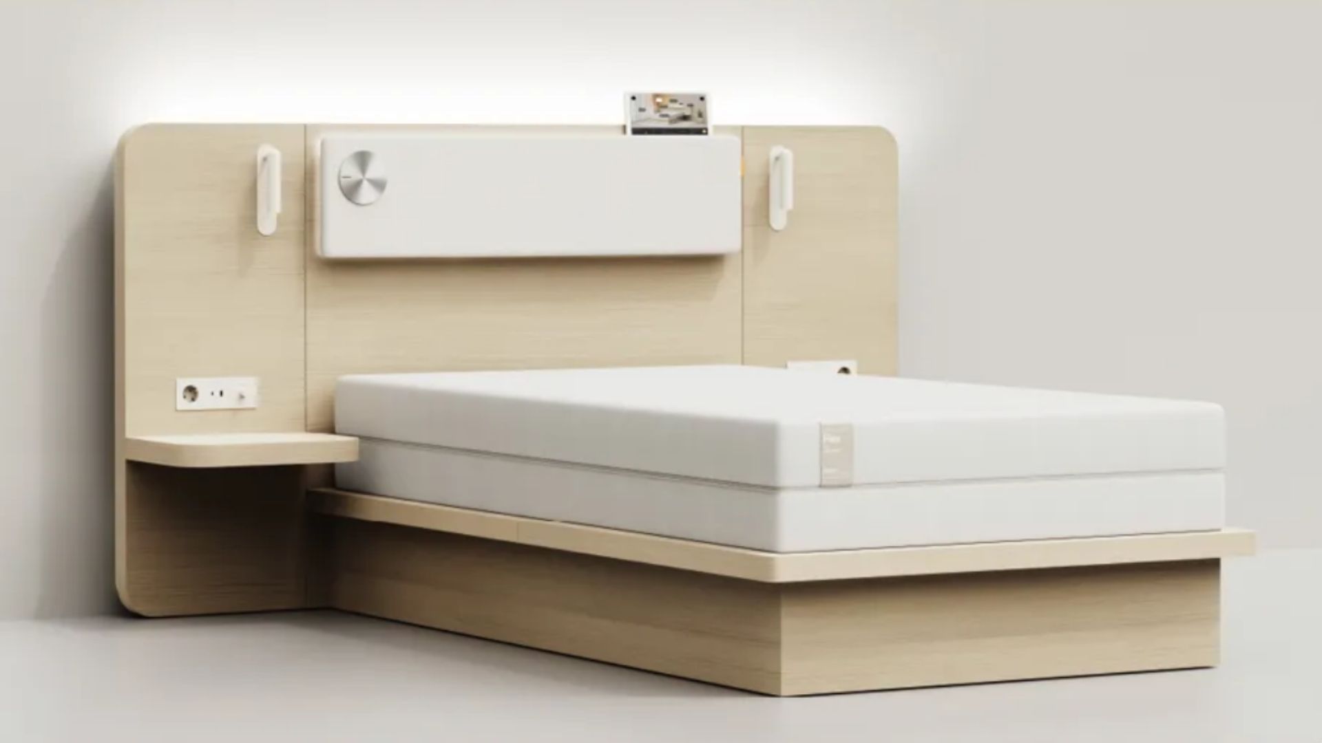 Neuro Wellness Youth Smart Mattress on wooden bedframe in white room