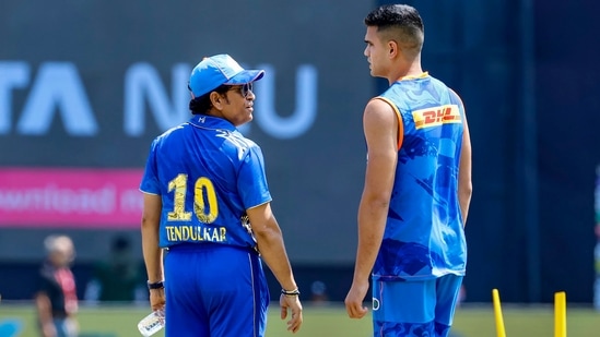 Sachin Tendulkar (L) with son Arjun Tendulkar during a training camp for Mumbai Indians.(PTI)